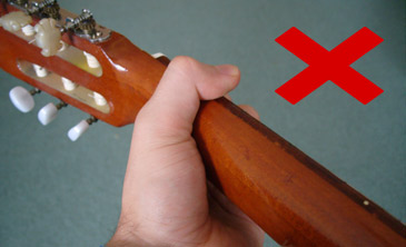 Incorrect thumb position for playing guitar